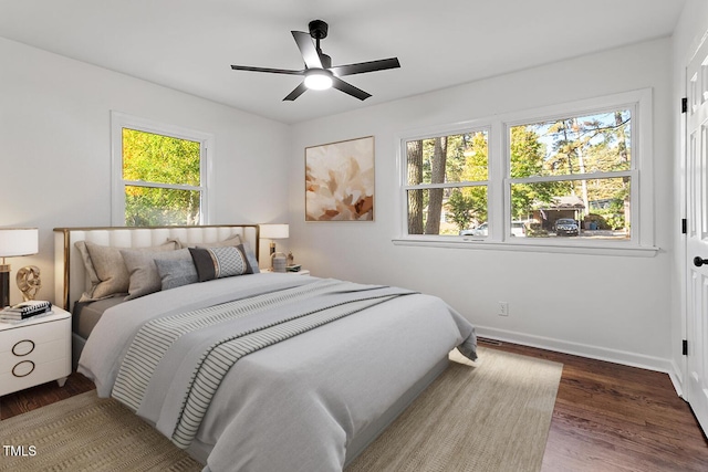 bedroom featuring ceiling fan and dark wood-type flooring