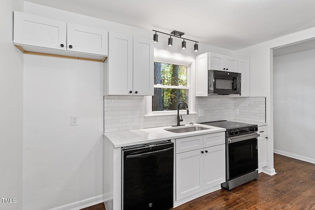 kitchen featuring white cabinets, sink, backsplash, and black appliances