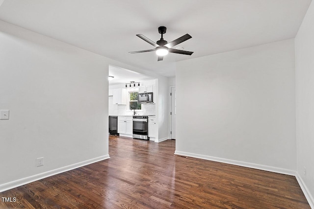 unfurnished living room with dark hardwood / wood-style floors and ceiling fan