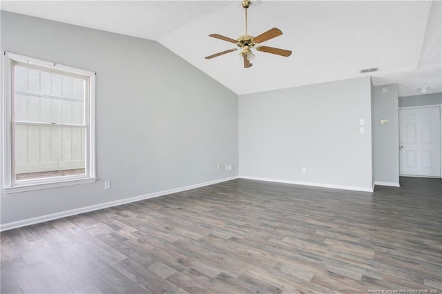 empty room with lofted ceiling, ceiling fan, and dark wood-type flooring