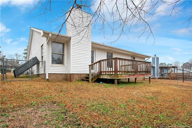 back of property with a wooden deck