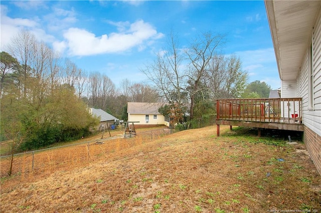 view of yard featuring a wooden deck