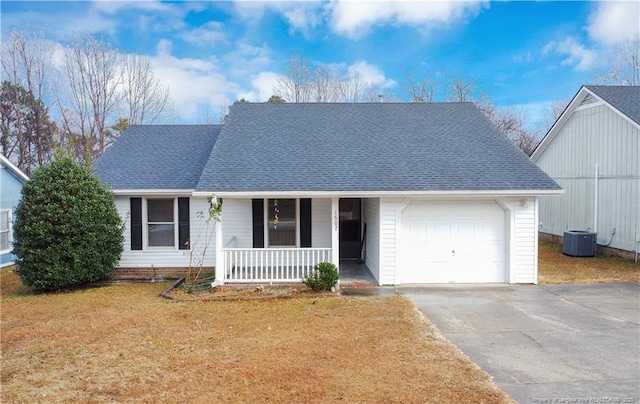 view of front facade featuring covered porch, a front yard, a garage, and central air condition unit