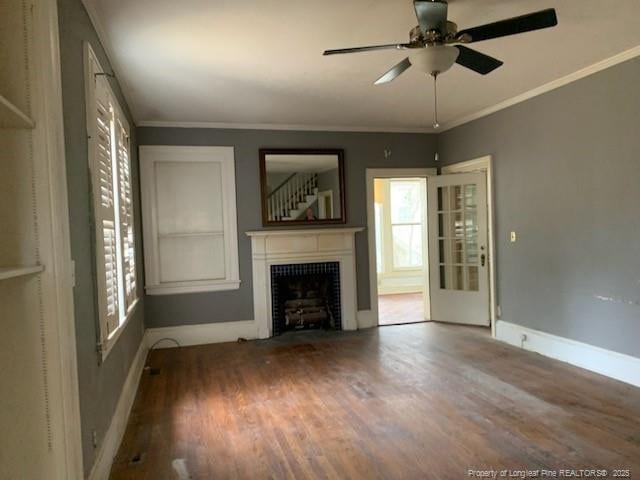 unfurnished living room featuring hardwood / wood-style floors, ceiling fan, and ornamental molding