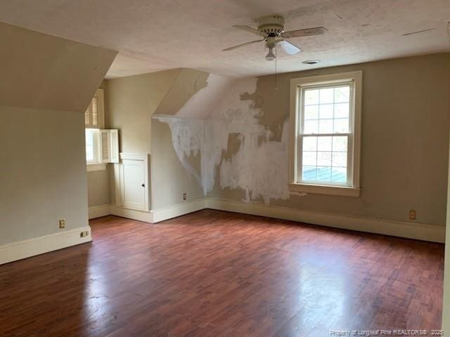 bonus room with wood-type flooring, ceiling fan, and lofted ceiling