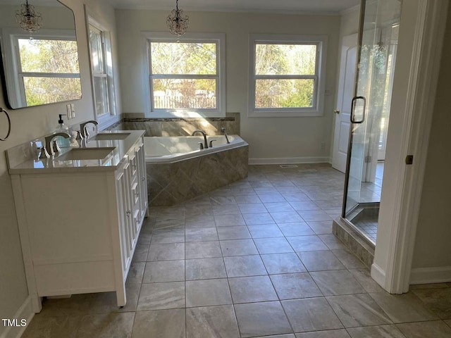 bathroom featuring a chandelier, shower with separate bathtub, vanity, and tile patterned floors