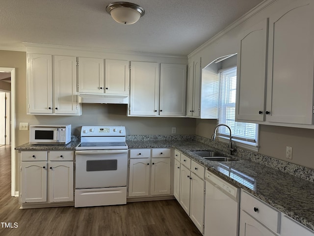 kitchen with dark hardwood / wood-style flooring, white cabinetry, sink, and white appliances