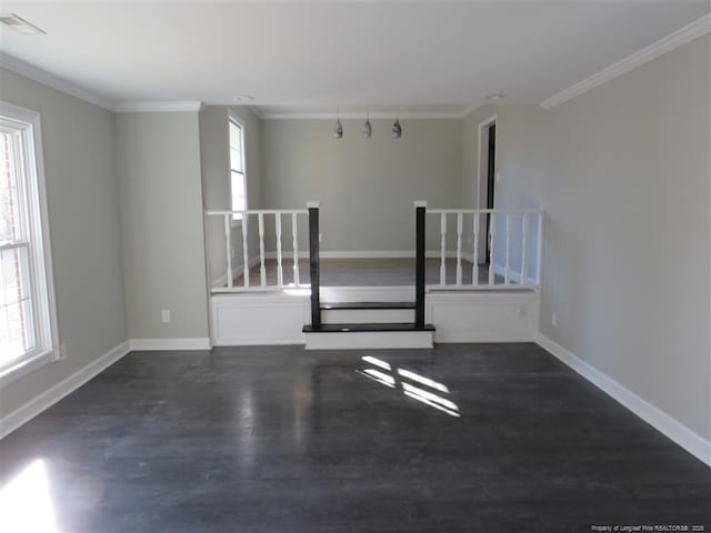 unfurnished room with dark hardwood / wood-style floors and crown molding