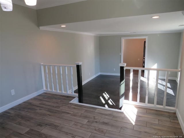 spare room featuring crown molding