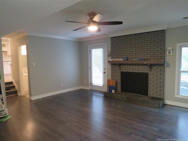 unfurnished living room with ceiling fan, a fireplace, dark hardwood / wood-style floors, and ornamental molding