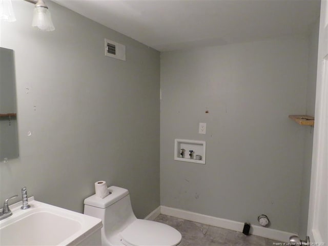 bathroom with tile patterned floors, sink, and toilet