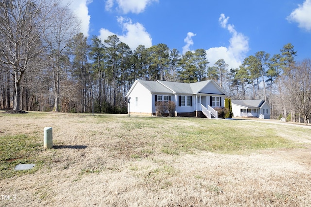 ranch-style house with a front yard