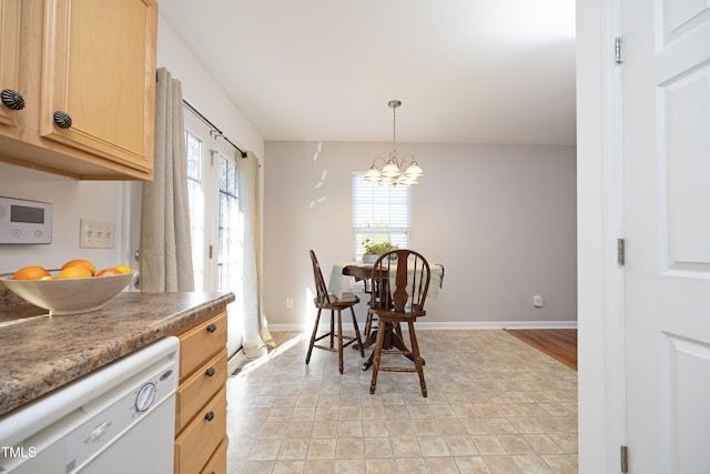 dining area with an inviting chandelier