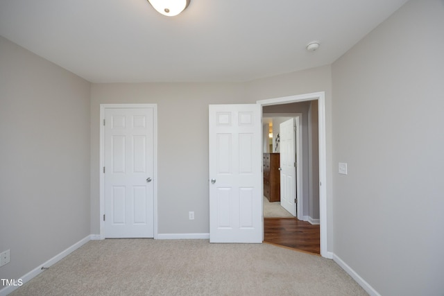 unfurnished bedroom with light carpet