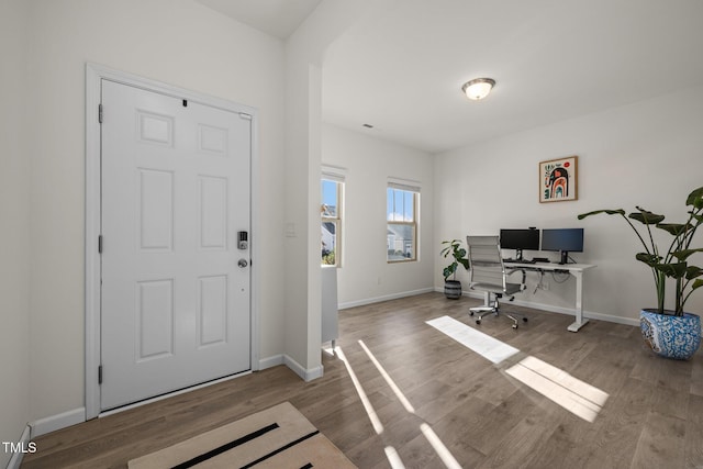 office featuring baseboards and wood finished floors