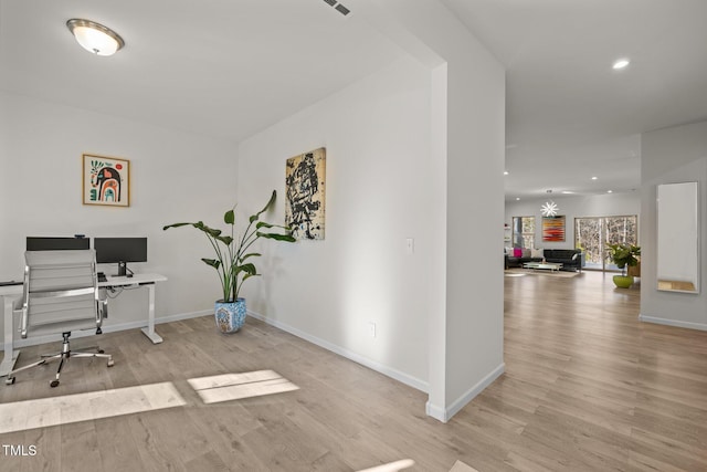 home office with recessed lighting, baseboards, and wood finished floors