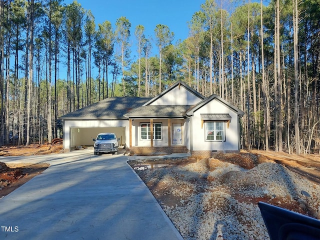 ranch-style house featuring a garage