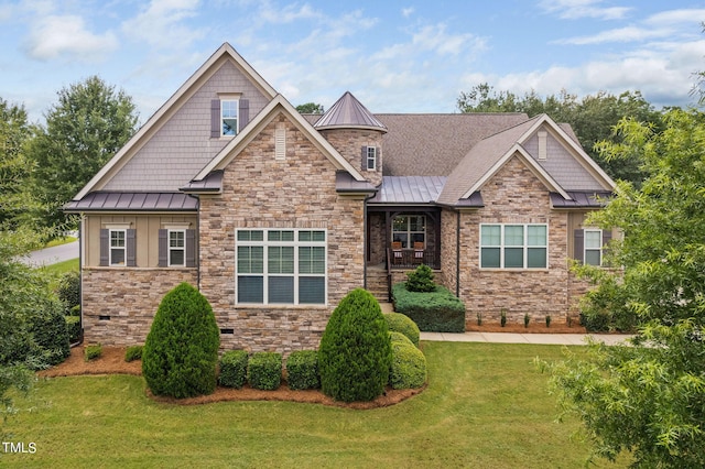 craftsman house with a front lawn