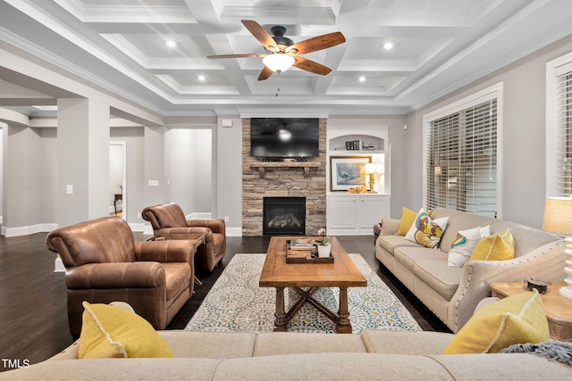 living room with hardwood / wood-style flooring, beam ceiling, a stone fireplace, and coffered ceiling