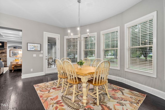 dining area featuring dark wood-type flooring