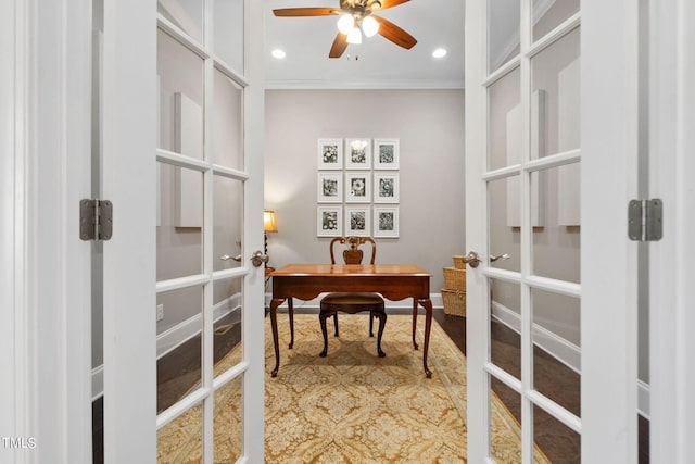 office space featuring french doors, ceiling fan, and crown molding