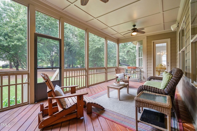 sunroom / solarium with plenty of natural light and ceiling fan