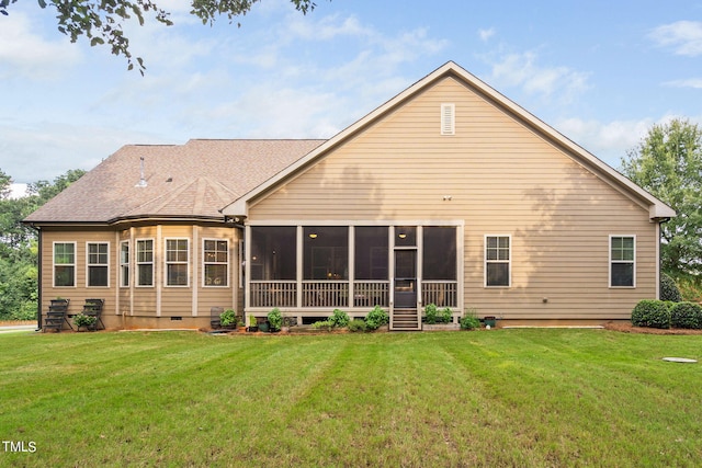 back of property with a lawn and a sunroom