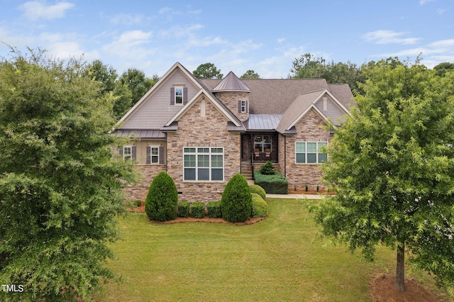 craftsman-style home with a front lawn