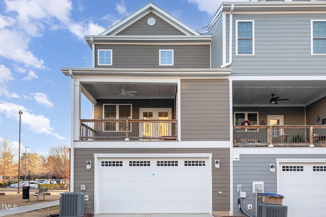 view of front of house with a balcony, ceiling fan, and cooling unit