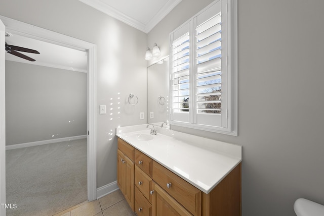 bathroom featuring ceiling fan, tile patterned flooring, vanity, and ornamental molding