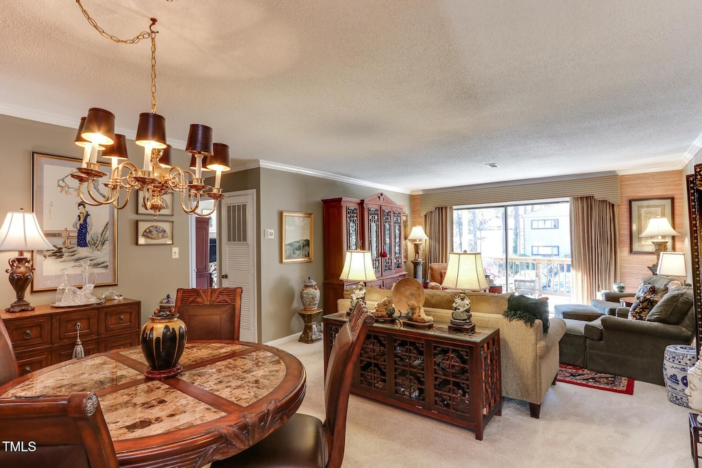 carpeted dining room featuring a textured ceiling, a notable chandelier, and crown molding