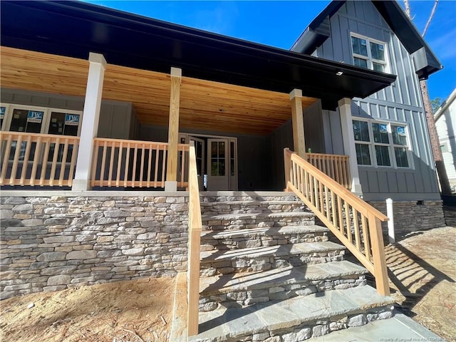 view of property exterior featuring covered porch