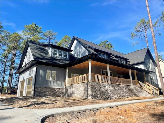 view of property exterior featuring covered porch