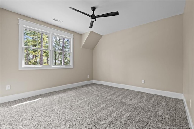 bonus room with carpet floors, ceiling fan, visible vents, and baseboards