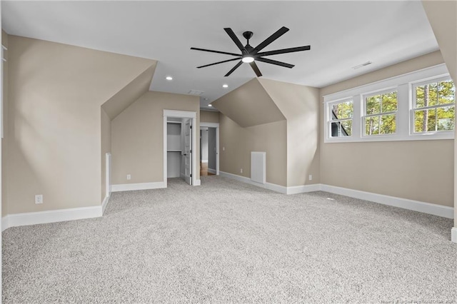 bonus room featuring lofted ceiling, recessed lighting, carpet flooring, a ceiling fan, and baseboards