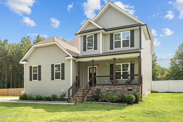 craftsman-style house with covered porch and a front yard