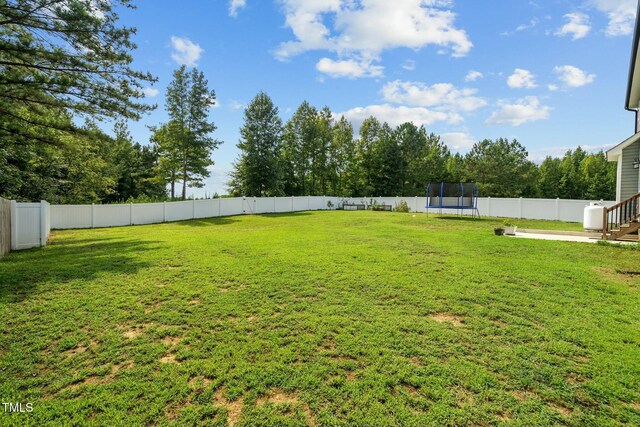 view of yard featuring a trampoline