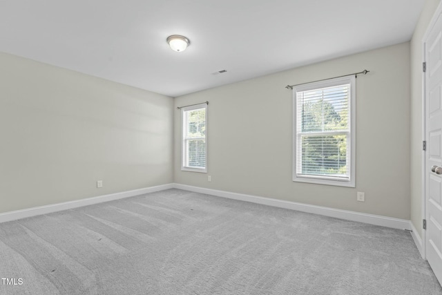 empty room featuring light colored carpet