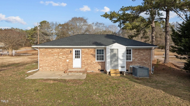 rear view of house featuring central AC, a patio area, and a lawn