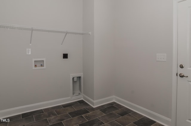 washroom featuring dark tile patterned floors, hookup for a washing machine, and electric dryer hookup