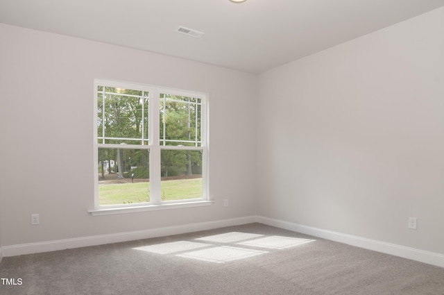 unfurnished room featuring carpet flooring