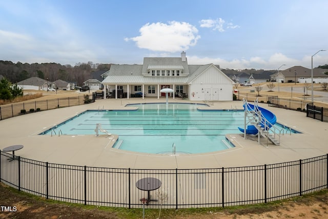 view of swimming pool with a patio area