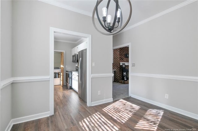 unfurnished dining area with crown molding, a chandelier, and dark hardwood / wood-style flooring