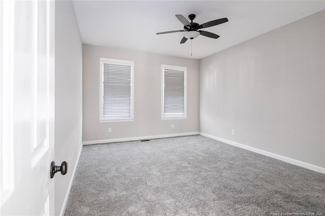 unfurnished room featuring carpet and ceiling fan