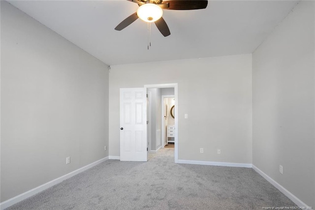 unfurnished bedroom featuring ceiling fan and light colored carpet