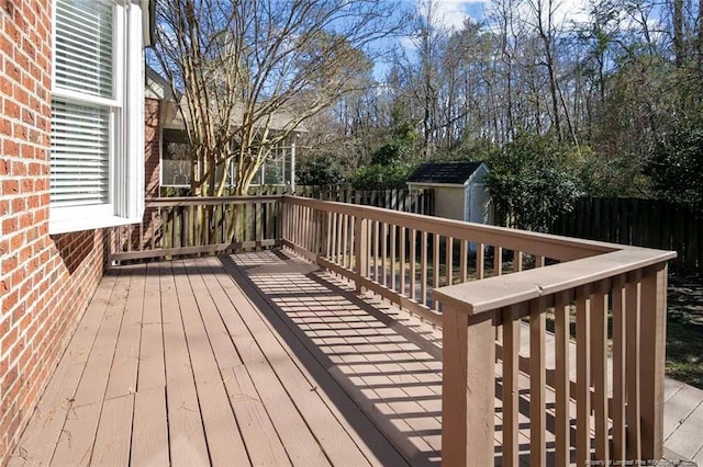 wooden deck with a storage shed