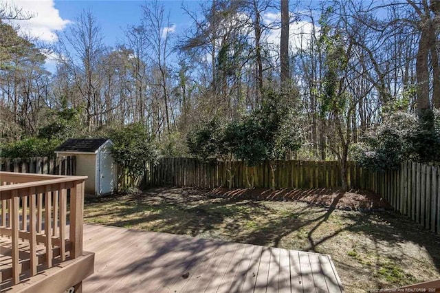 wooden terrace with a storage shed