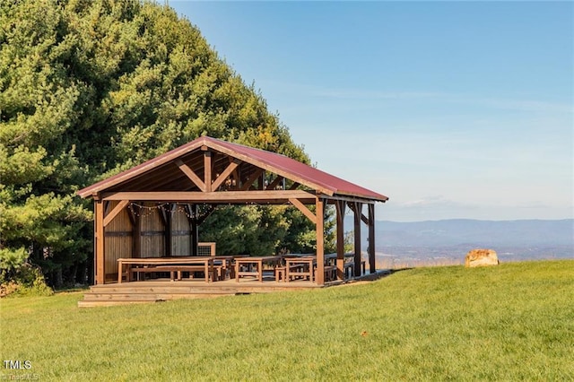 view of home's community featuring a mountain view, a gazebo, and a yard