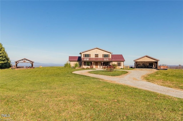 view of front of home with a rural view and a front yard