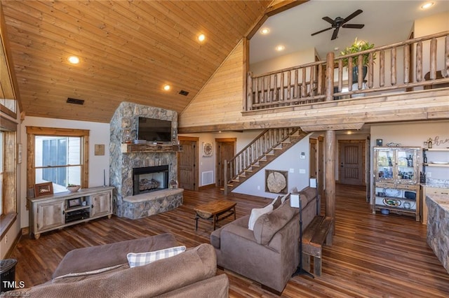 living room featuring a stone fireplace, ceiling fan, high vaulted ceiling, and wooden ceiling